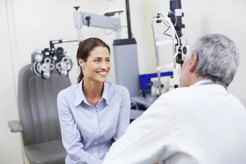 An ophthalmologist talking to a patient An ophthalmologist talking through the informed consent with a patient