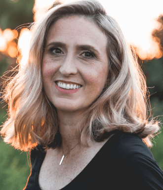 Woman wearing black shirt and smiling